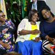 Pearlie Mae Smith, center, reacts as she sits with daughters Rene Bethina Smith and Katherine Nicole Nunnally as they talk about life after winning the lottery May 13, 2016, in Lawrenceville, N.J. (Mel Evans/AP Images)